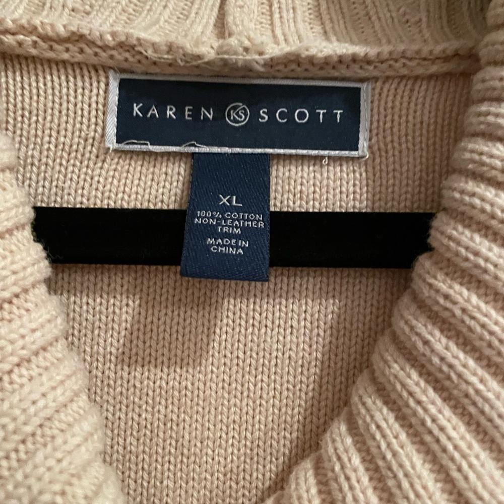 A scoop neck sweater in a beige tone color made bye Karen Scott